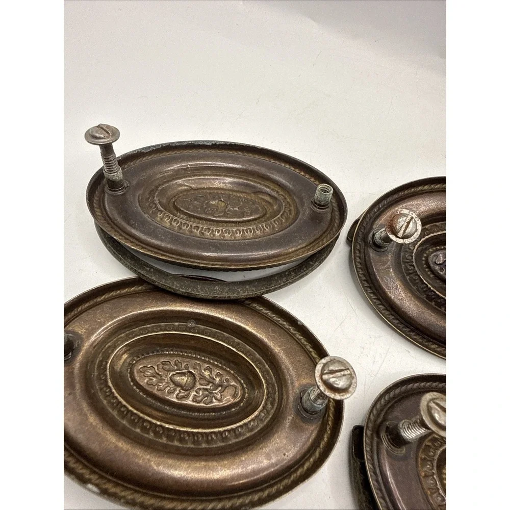 Antique Hepplewhite-style drawer pulls embossed oval backplate